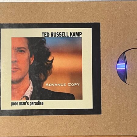 CD Ted Russell Kamp. Poor manus paradise. Promo